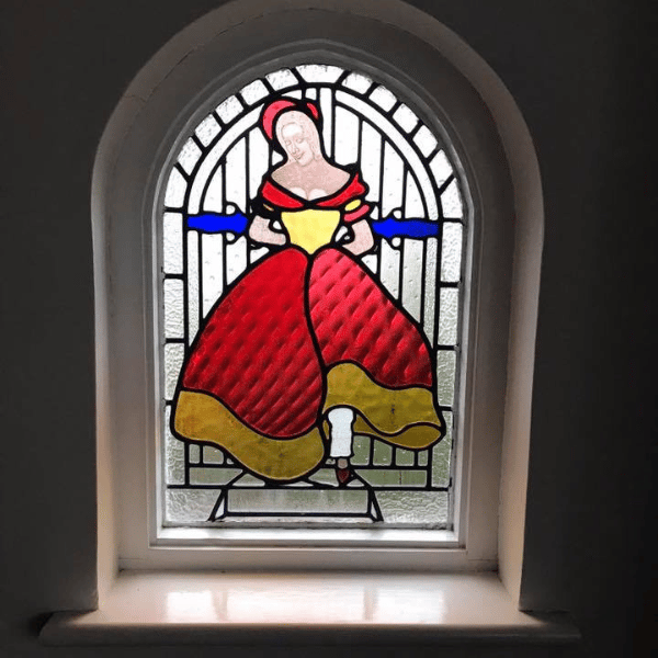 Stained glass arch window lady
