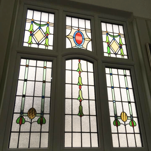 stained glass windows with arch detail
