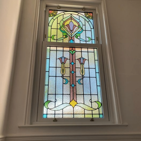 stunnish sash window with stained glass detail