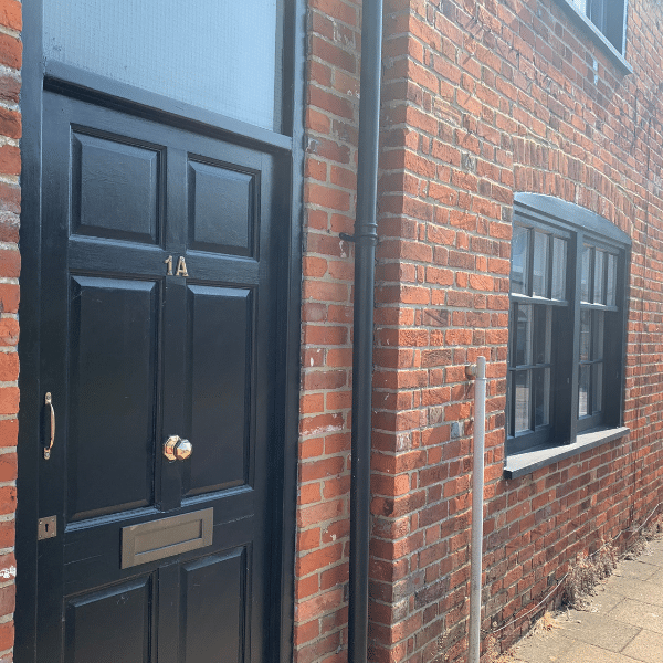 old houses with black timber windows and door