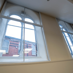 rectangular granada secondary glazing over arched windows